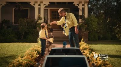 a man and a little girl standing in front of a house