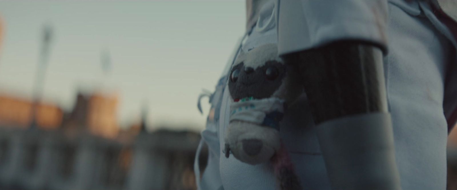 a close up of a person's shirt with a teddy bear on it