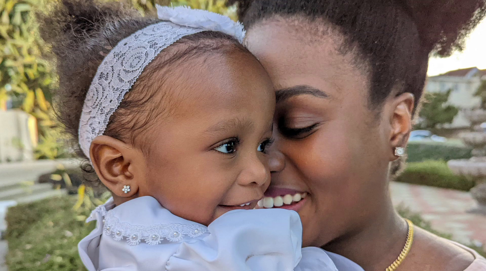 a woman holding a small child in her arms