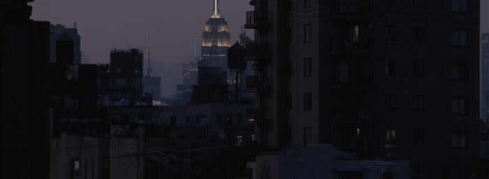 the empire building is lit up at night