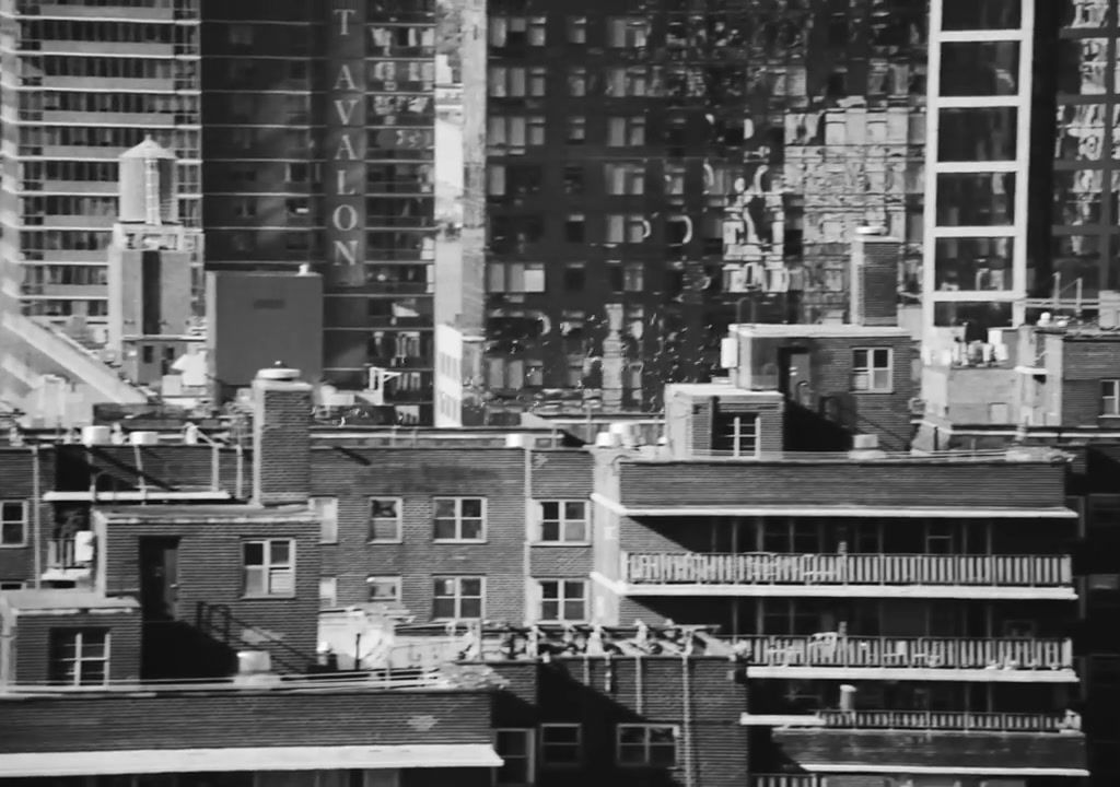 a black and white photo of buildings in a city