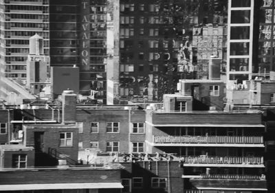 a black and white photo of buildings in a city