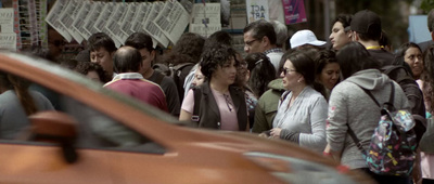 a large group of people walking down a street