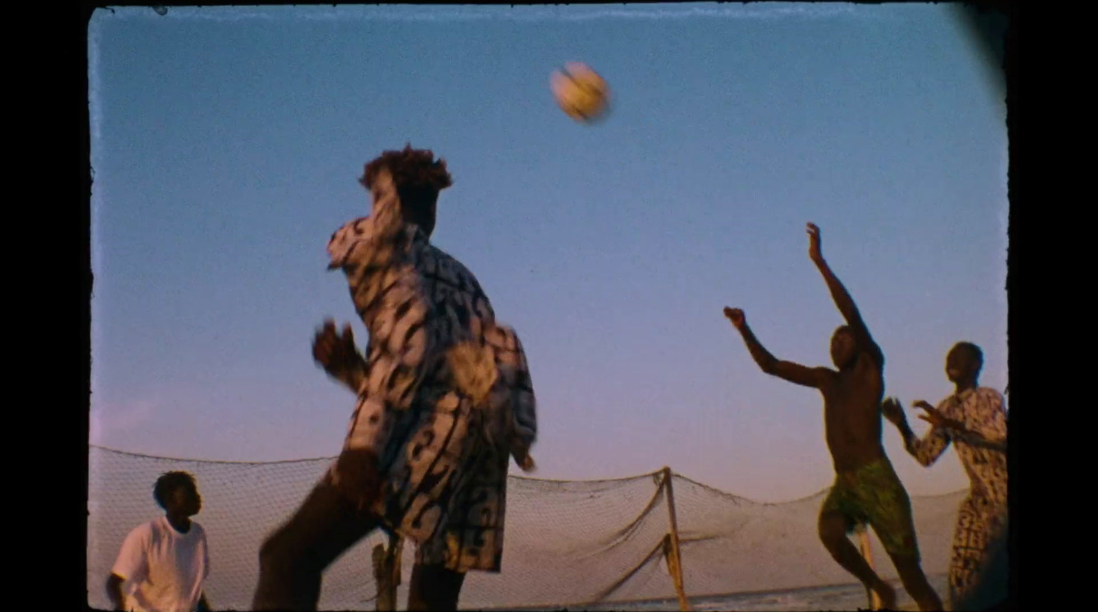 a group of men playing a game of frisbee