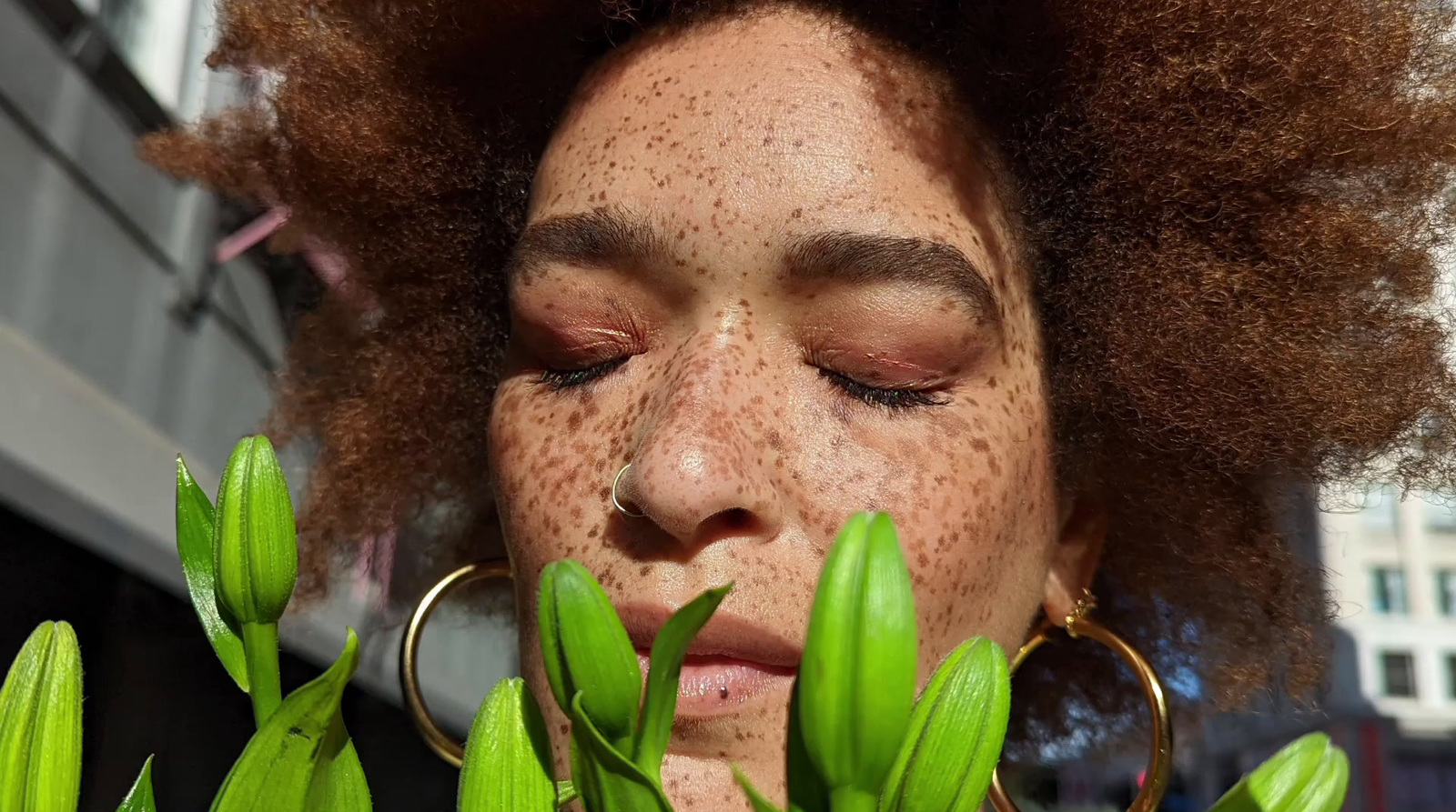 a close up of a person with freckles on her face