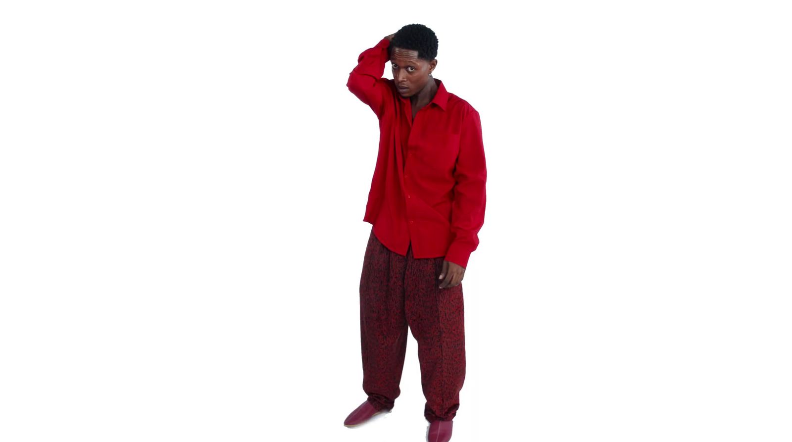 a man in a red shirt and red pants