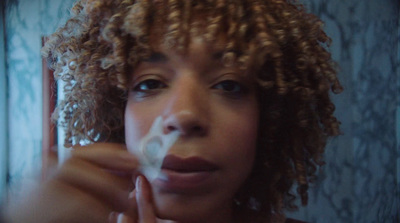 a close up of a person brushing her teeth