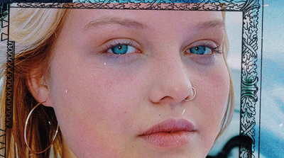 a close up of a person with blue eyes