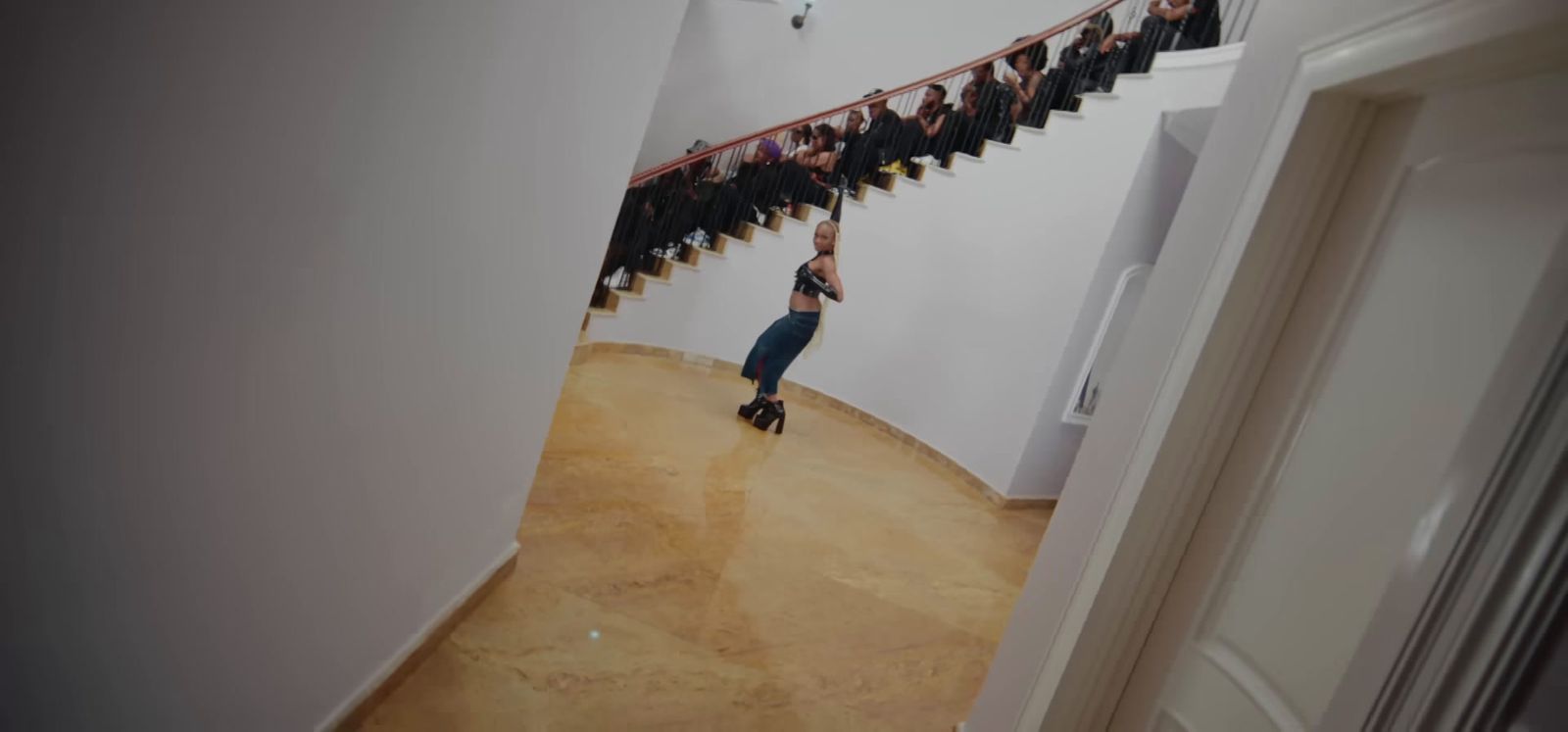 a woman standing in front of a bunch of stairs