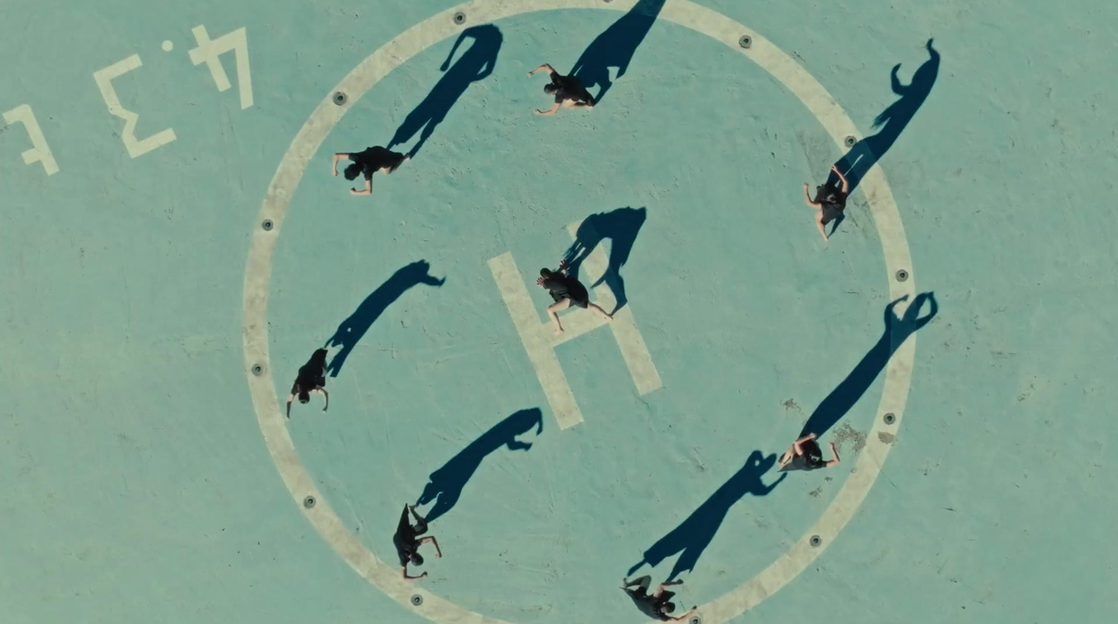 a group of people standing on top of a tennis court