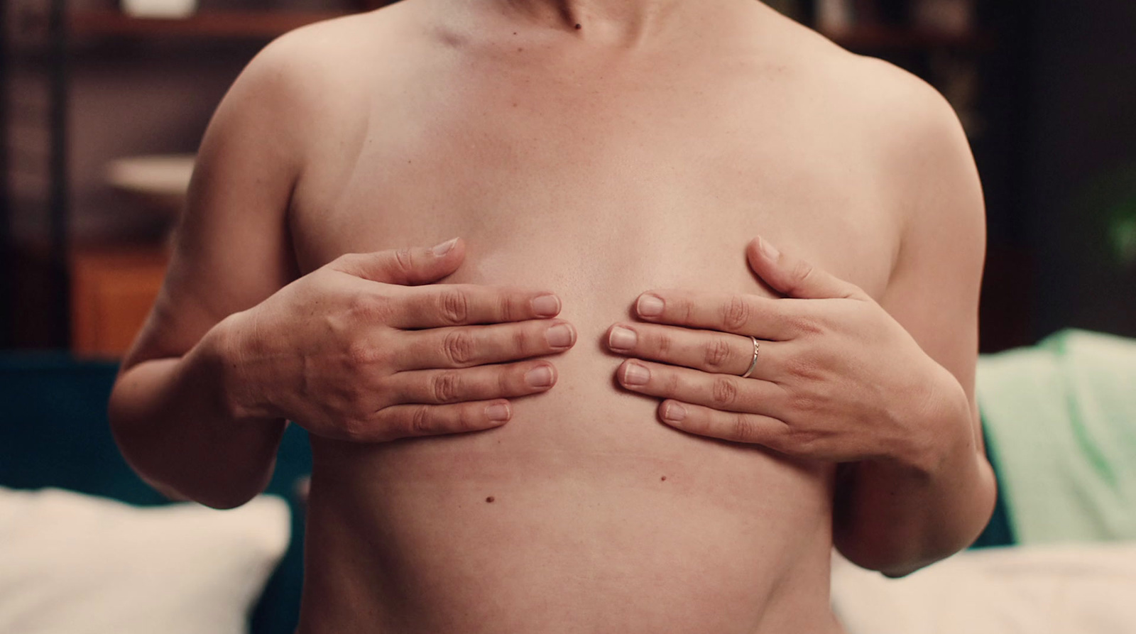 a person with their hands on their chest