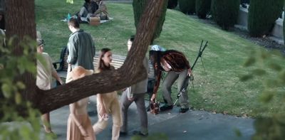 a group of people standing around a tree