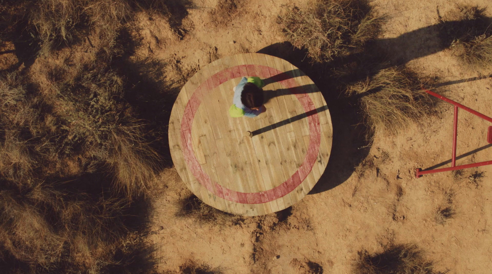 a person standing on top of a wooden target