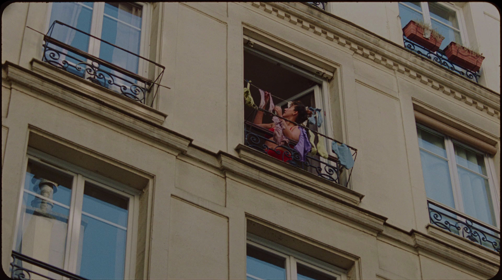 a couple of people that are standing on a balcony