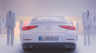 a white car parked in front of a group of people