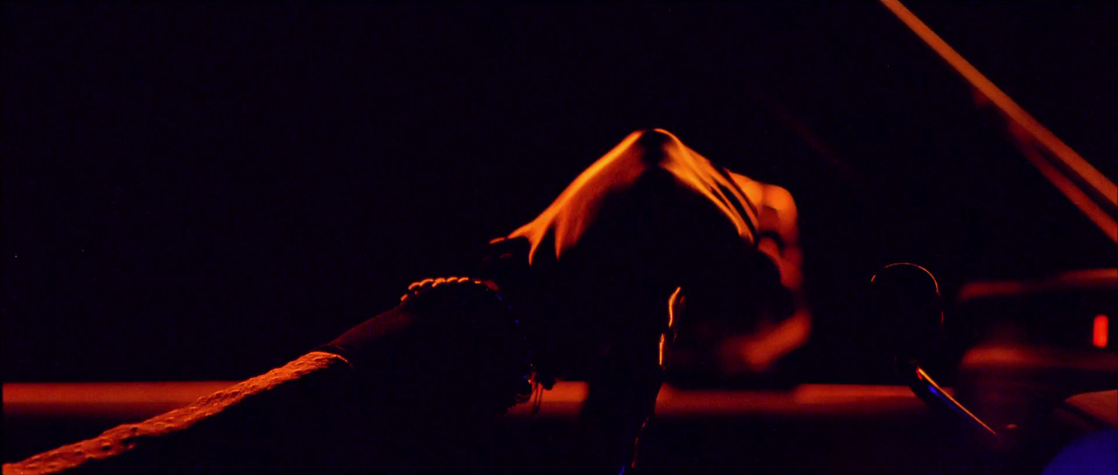 a person doing a handstand in the dark