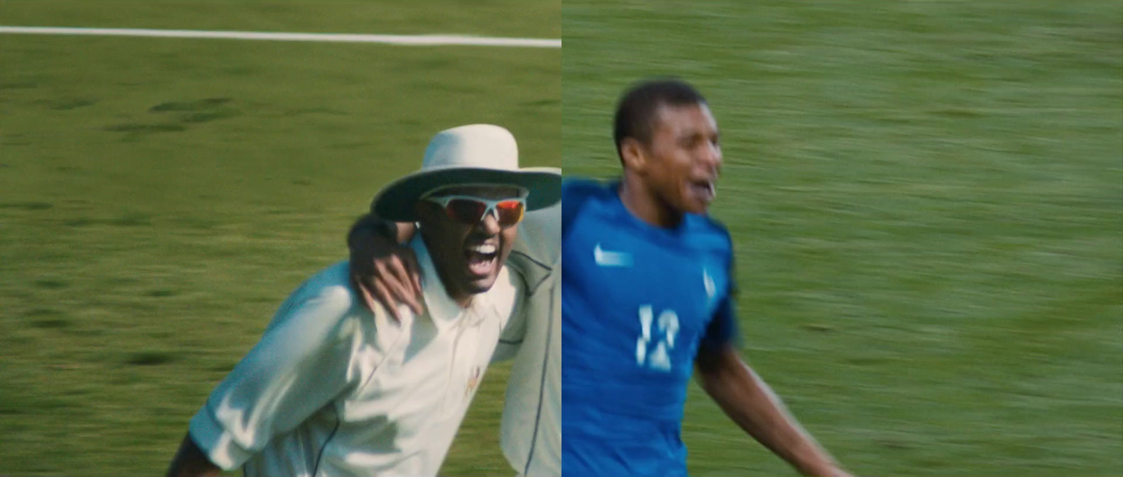 two men in white hats and blue shirts on a soccer field