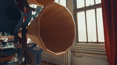 a large wooden object in front of a window