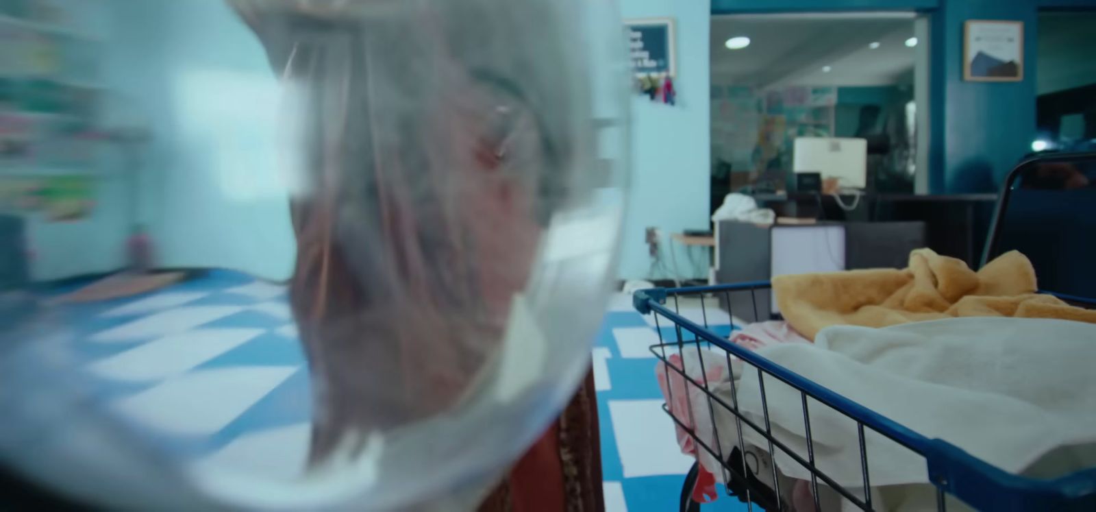 a blurry image of a woman's face through a plastic wrap