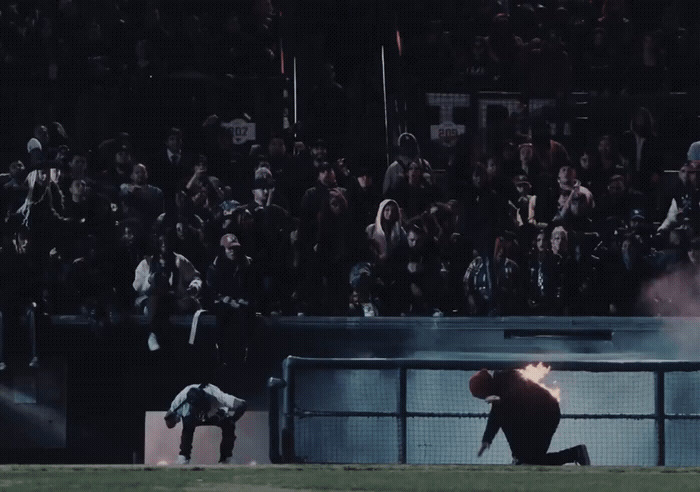 a baseball player sliding into a base during a game