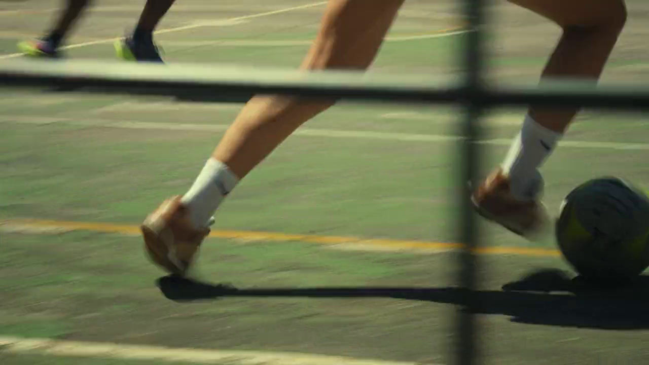 a close up of a person playing tennis on a court