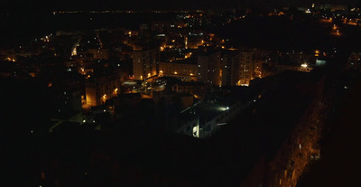 an aerial view of a city at night