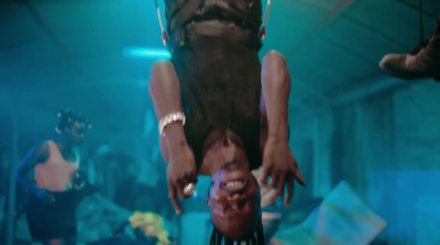 a man hanging upside down in a room