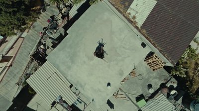 an aerial view of a skateboard park with people