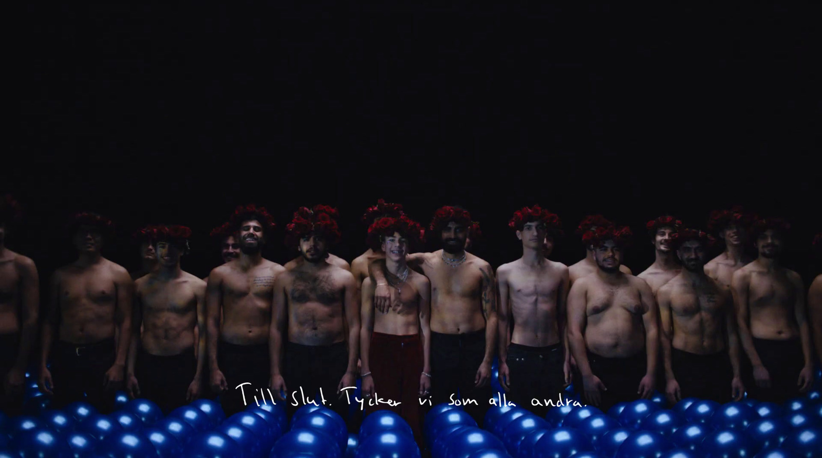 a group of naked men standing next to each other