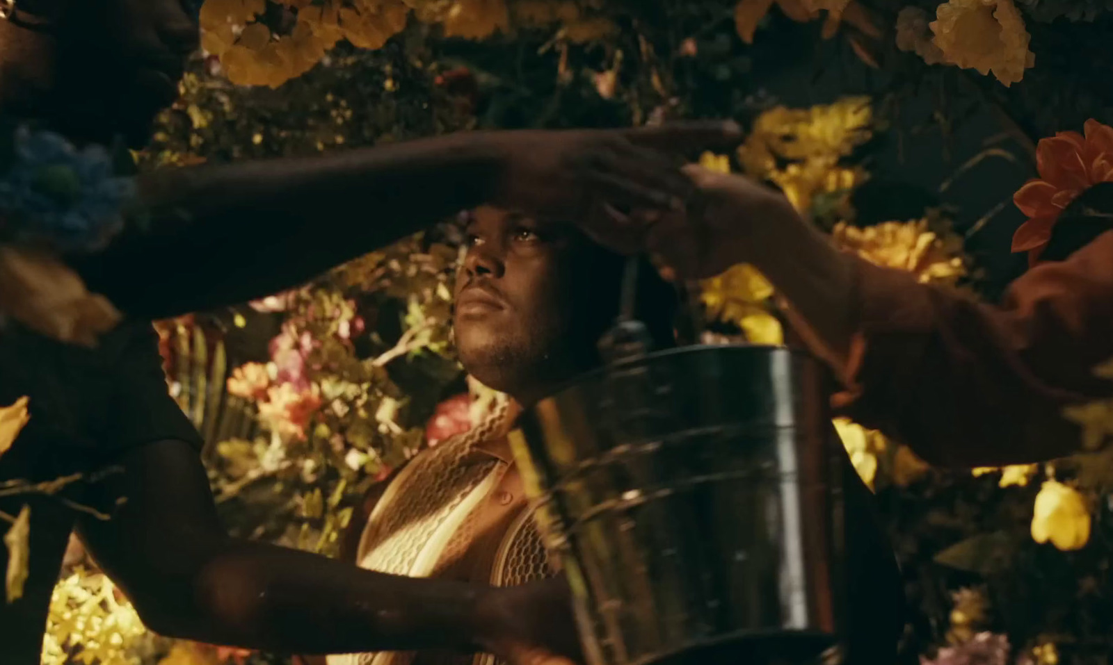 a woman is holding a bucket and another woman is holding a bucket