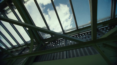 a metal structure with a sky in the background