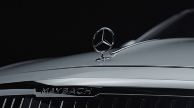 a mercedes logo is shown on the front of a car