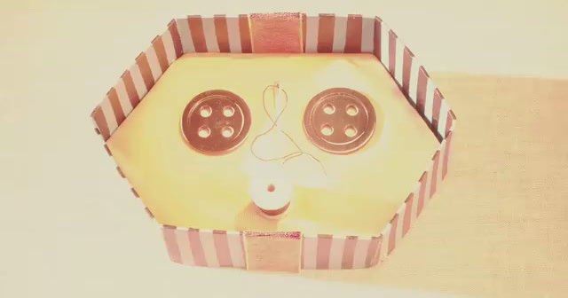 a cardboard box with a pair of eyeballs in it