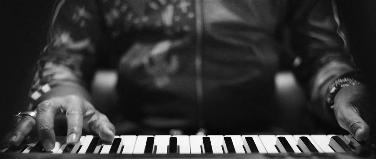 a close up of a person playing a piano