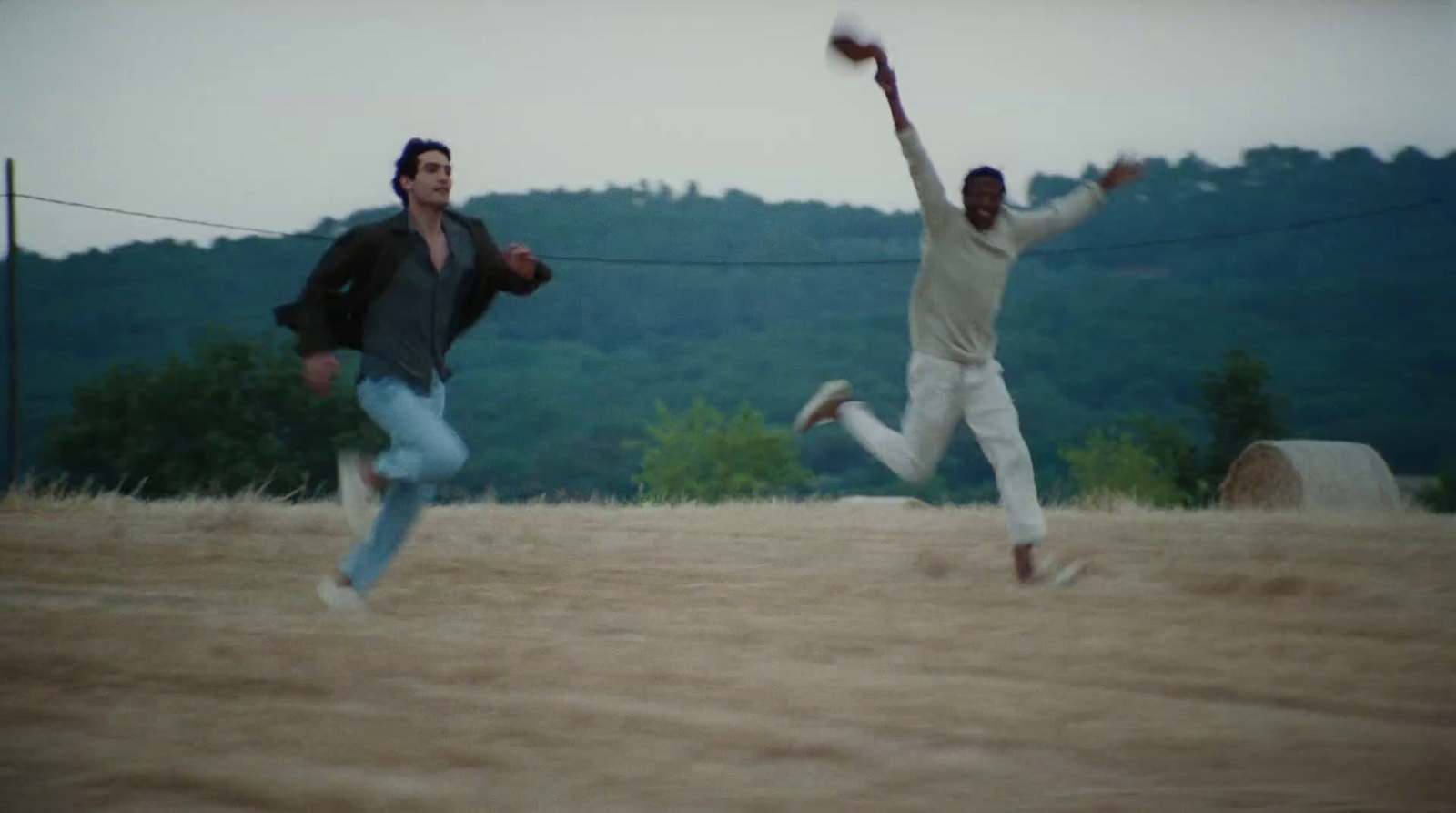 a couple of men playing a game of frisbee