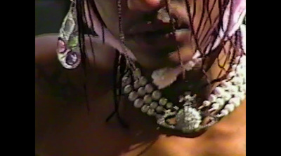 a close up of a woman's face wearing earrings