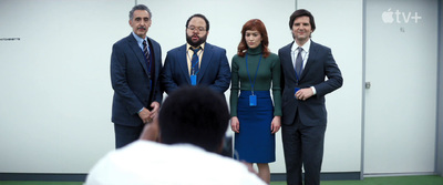 a group of people standing around each other