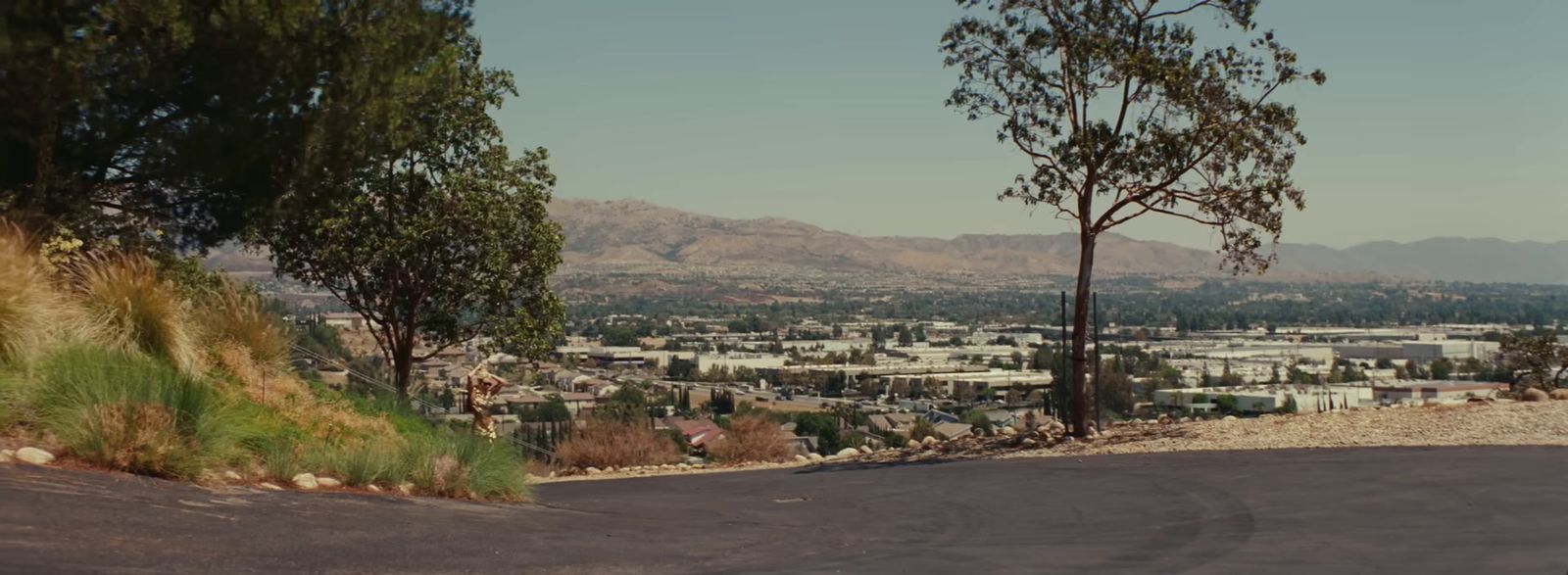 a view of a city from the top of a hill