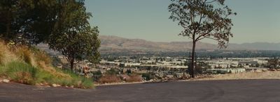 a view of a city from the top of a hill