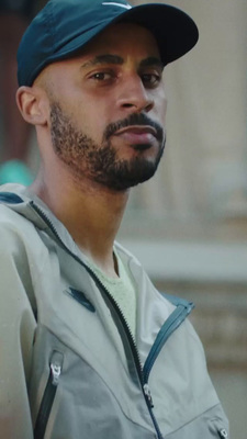 a man with a beard and a baseball cap