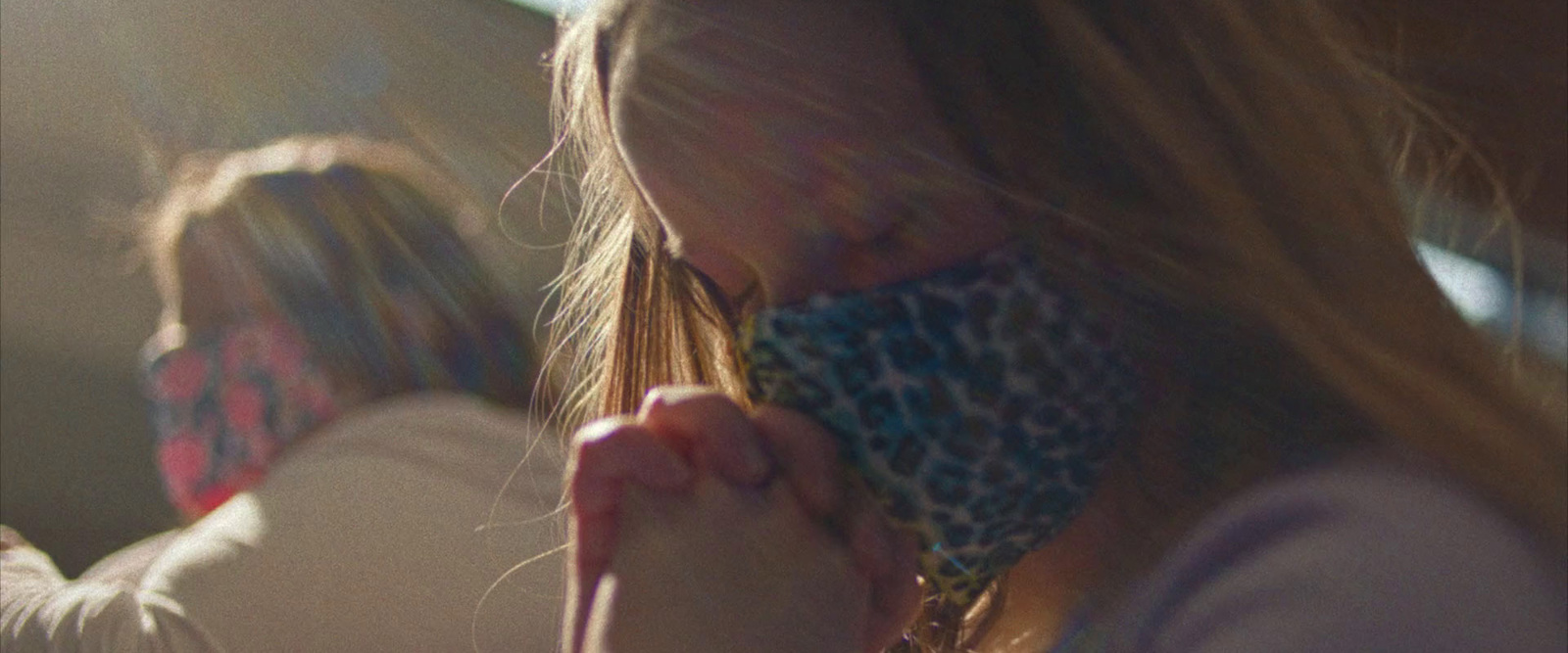 a woman with a scarf covering her face