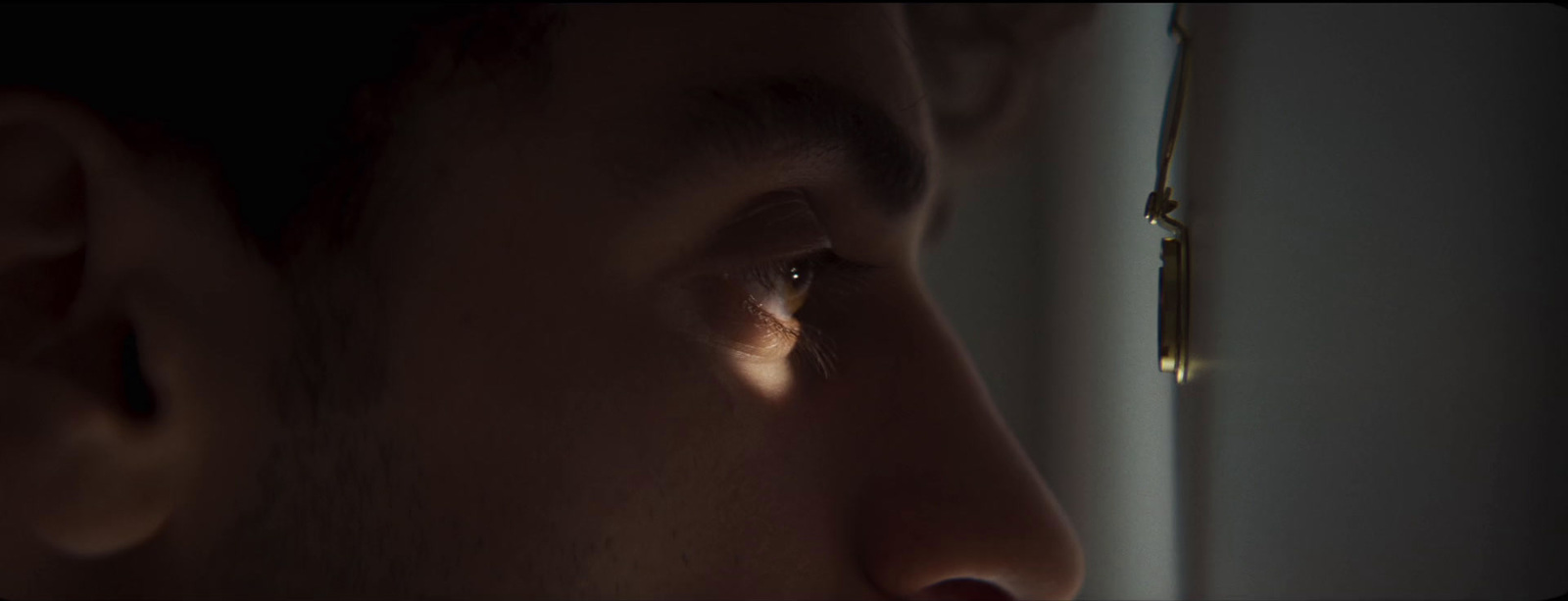 a close up of a person looking out a window