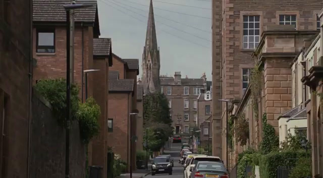 a street with cars parked on both sides of it