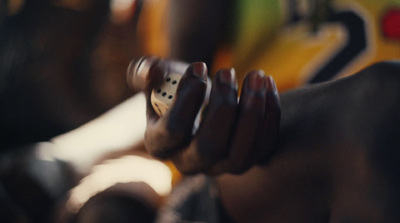 a close up of a person holding a dice