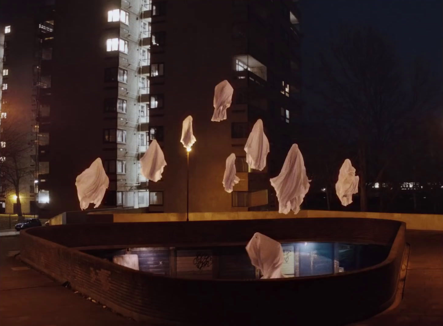 a group of white paper floating in the air