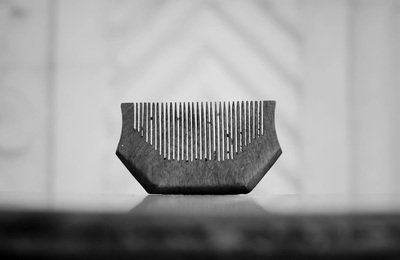 a wooden comb sitting on top of a table