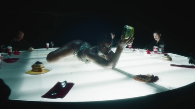 a woman laying on a table reading a book