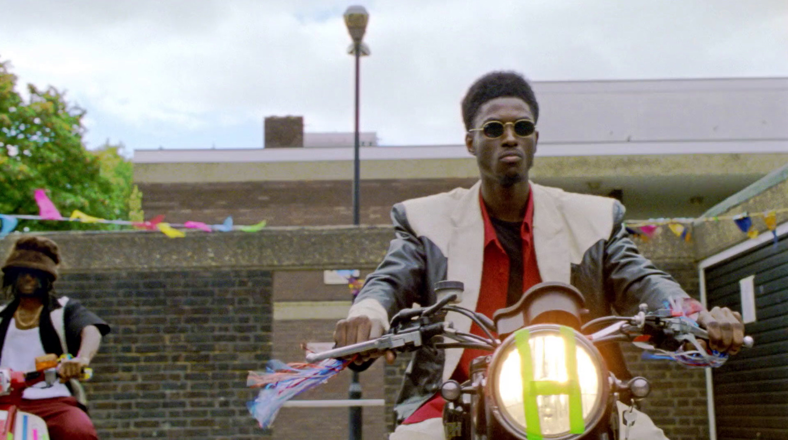 a man riding on the back of a motorcycle