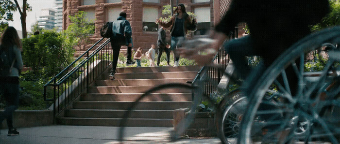 a group of people walking up a set of stairs