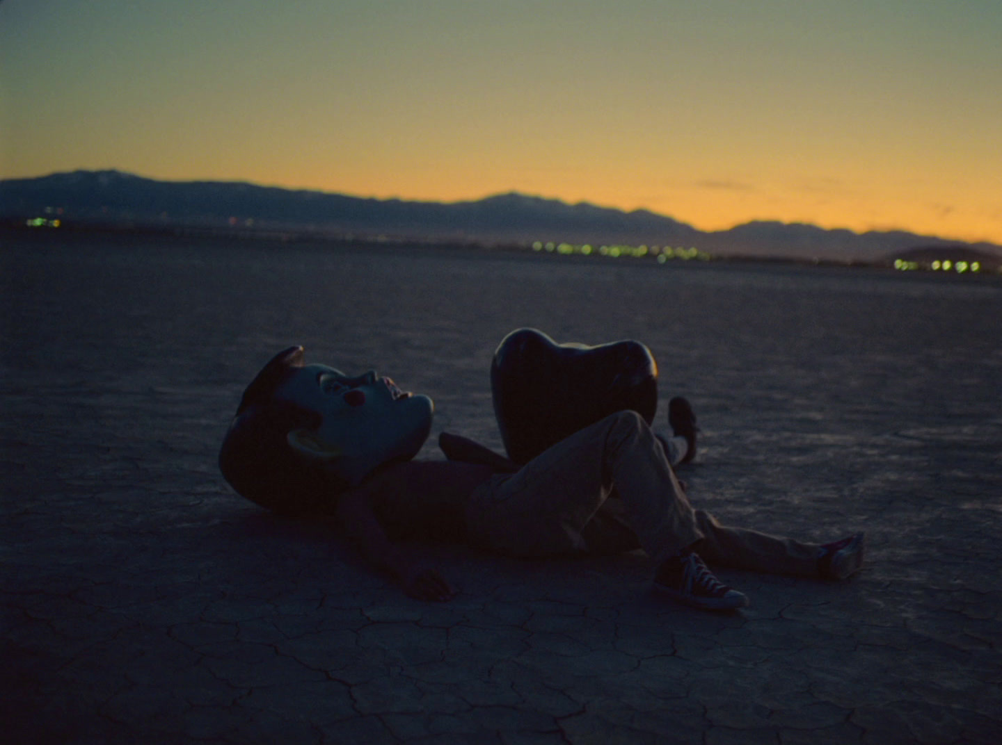 a person laying on the ground with a helmet on